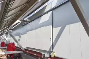 Acoustic barrier for coolers and air conditioners